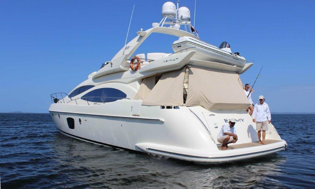 a white boat with people on it aboard EMMY Yacht for Charter