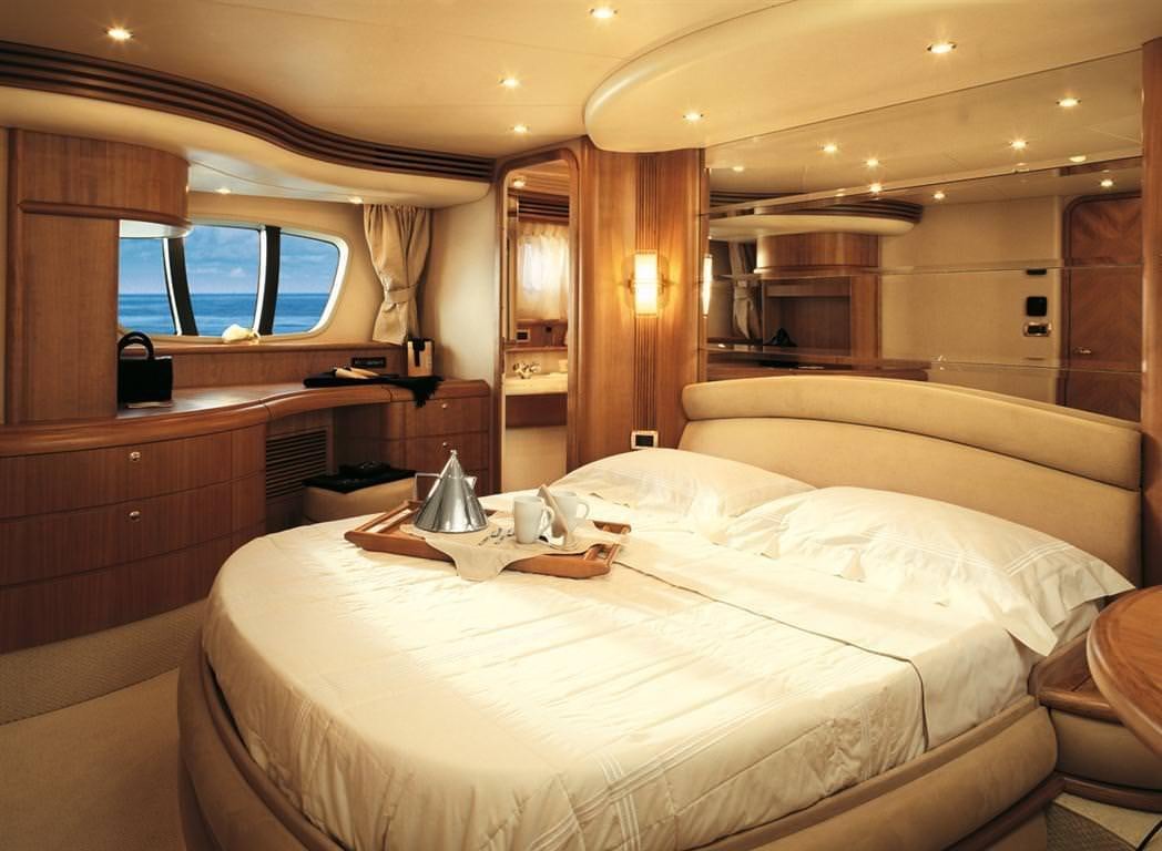 a hotel room with a bed aboard EMMY Yacht for Charter