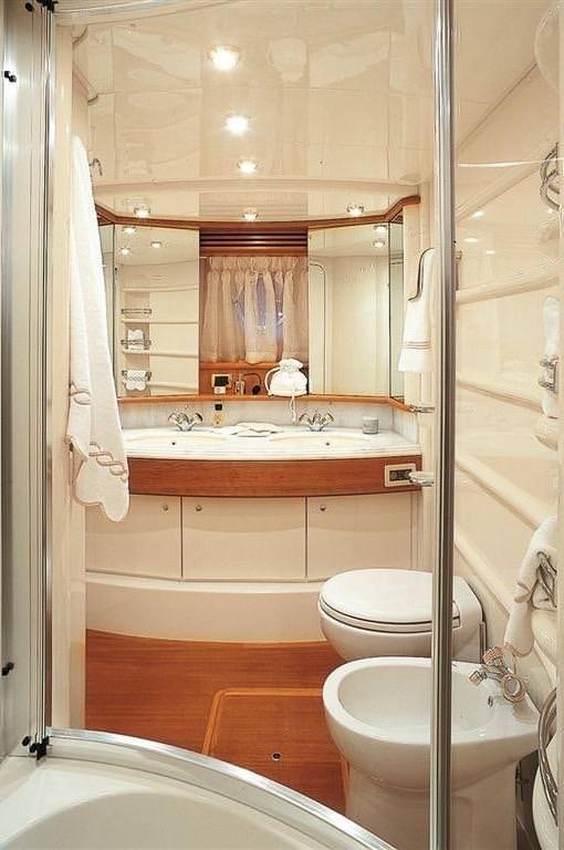 a bathroom with a sink and a toilet aboard EMMY Yacht for Charter