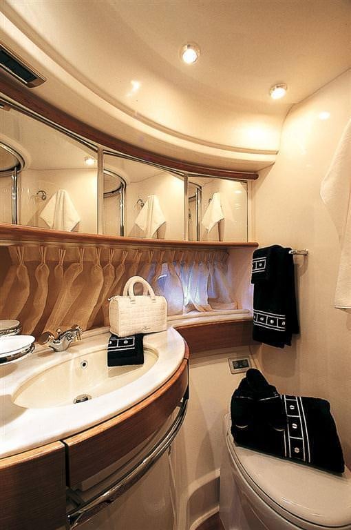 a bathroom with a sink and a mirror aboard EMMY Yacht for Charter