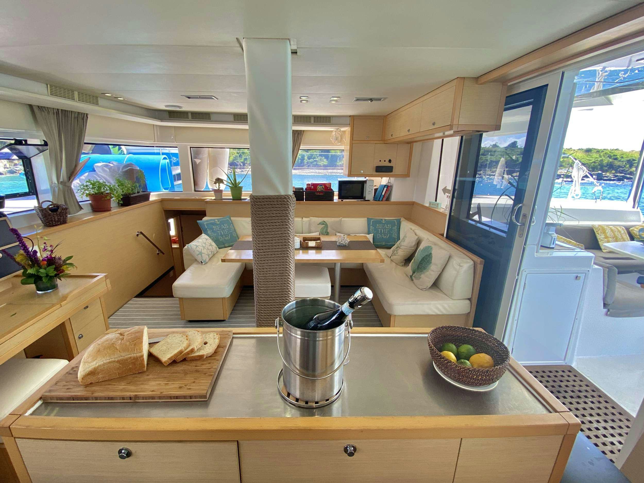 a kitchen with a large island aboard RUMBA Yacht for Charter