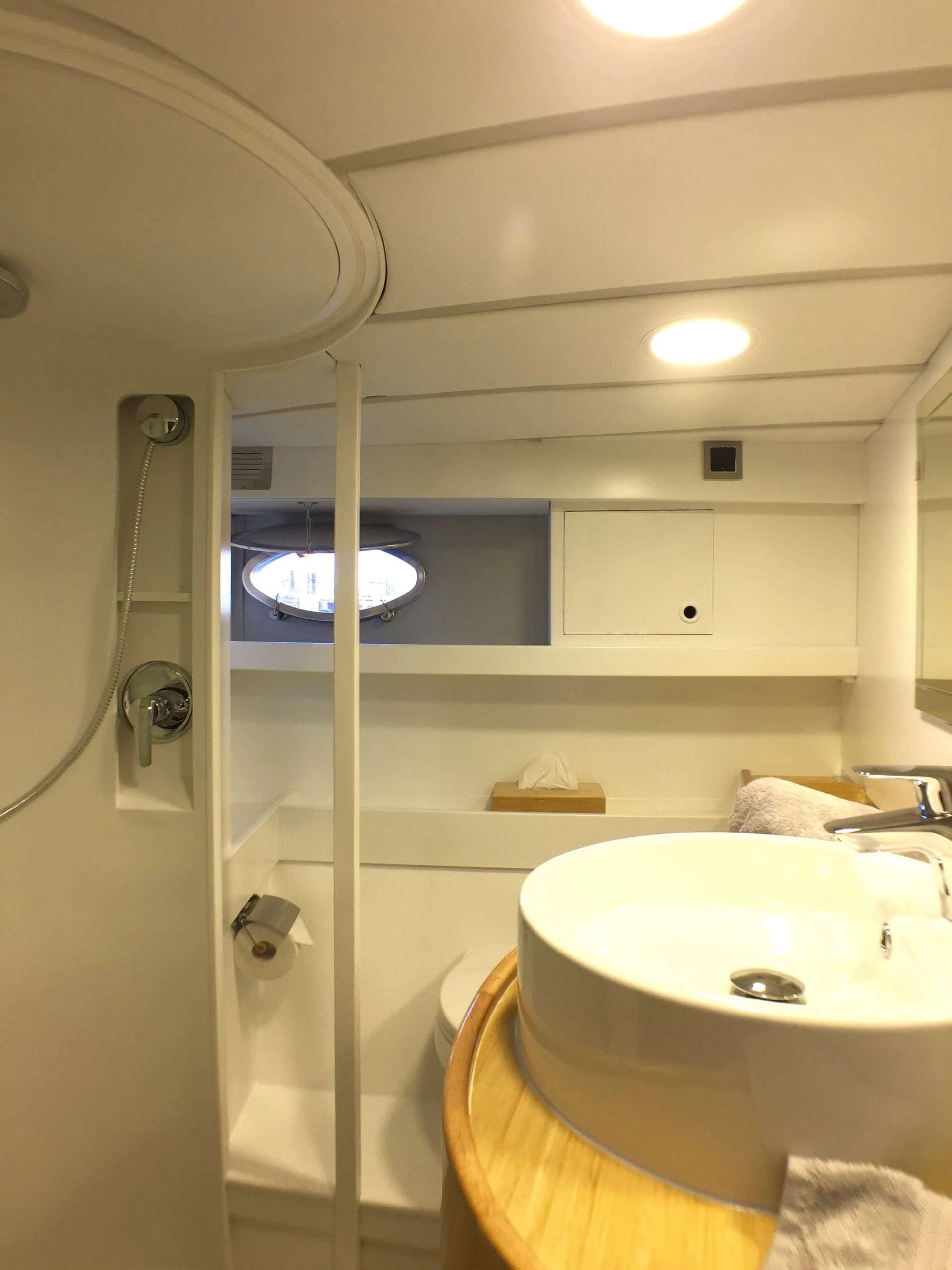 a bathroom with a sink and a shower aboard Bellacha Yacht for Charter