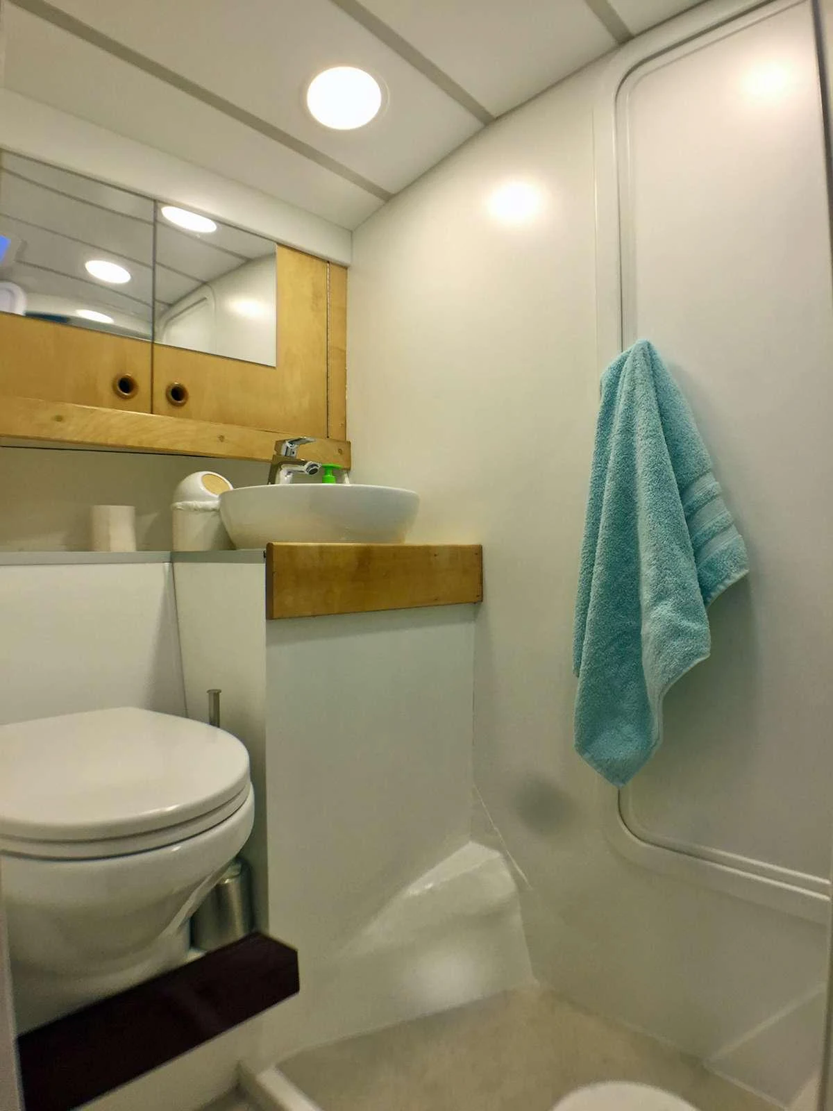 a bathroom with a sink and toilet aboard Bellacha Yacht for Charter