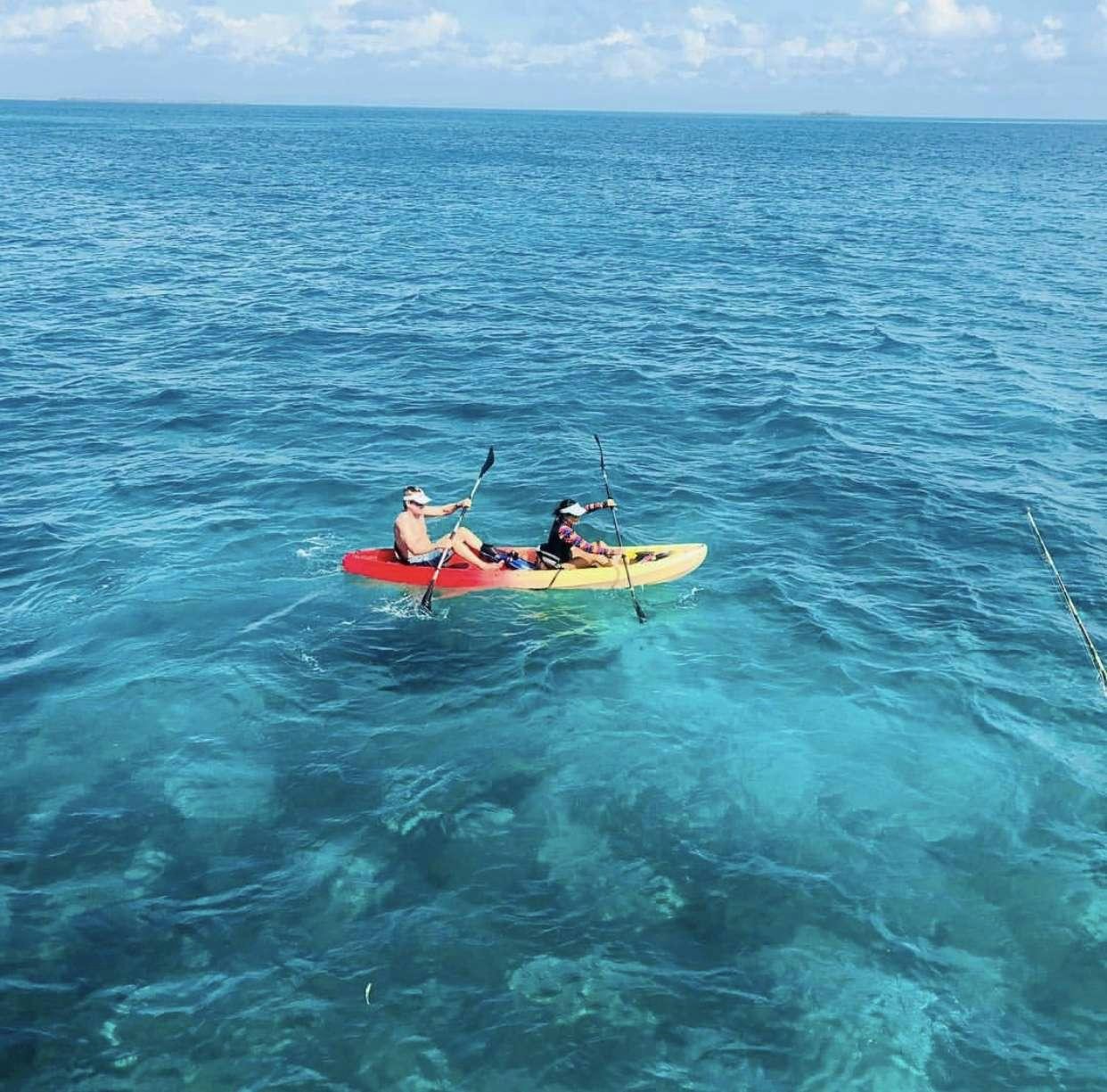 a group of people in a boat in the ocean aboard LUNA SEA Yacht for Charter