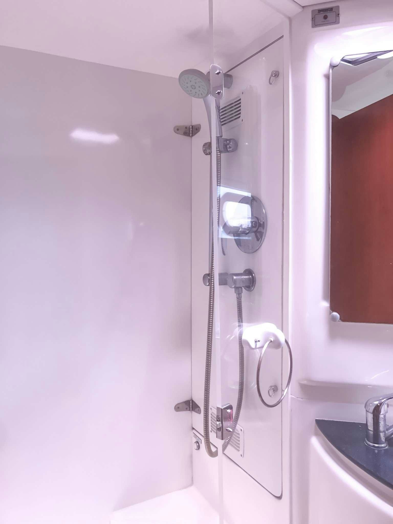 a shower unit with a glass door aboard LUNA SEA Yacht for Charter