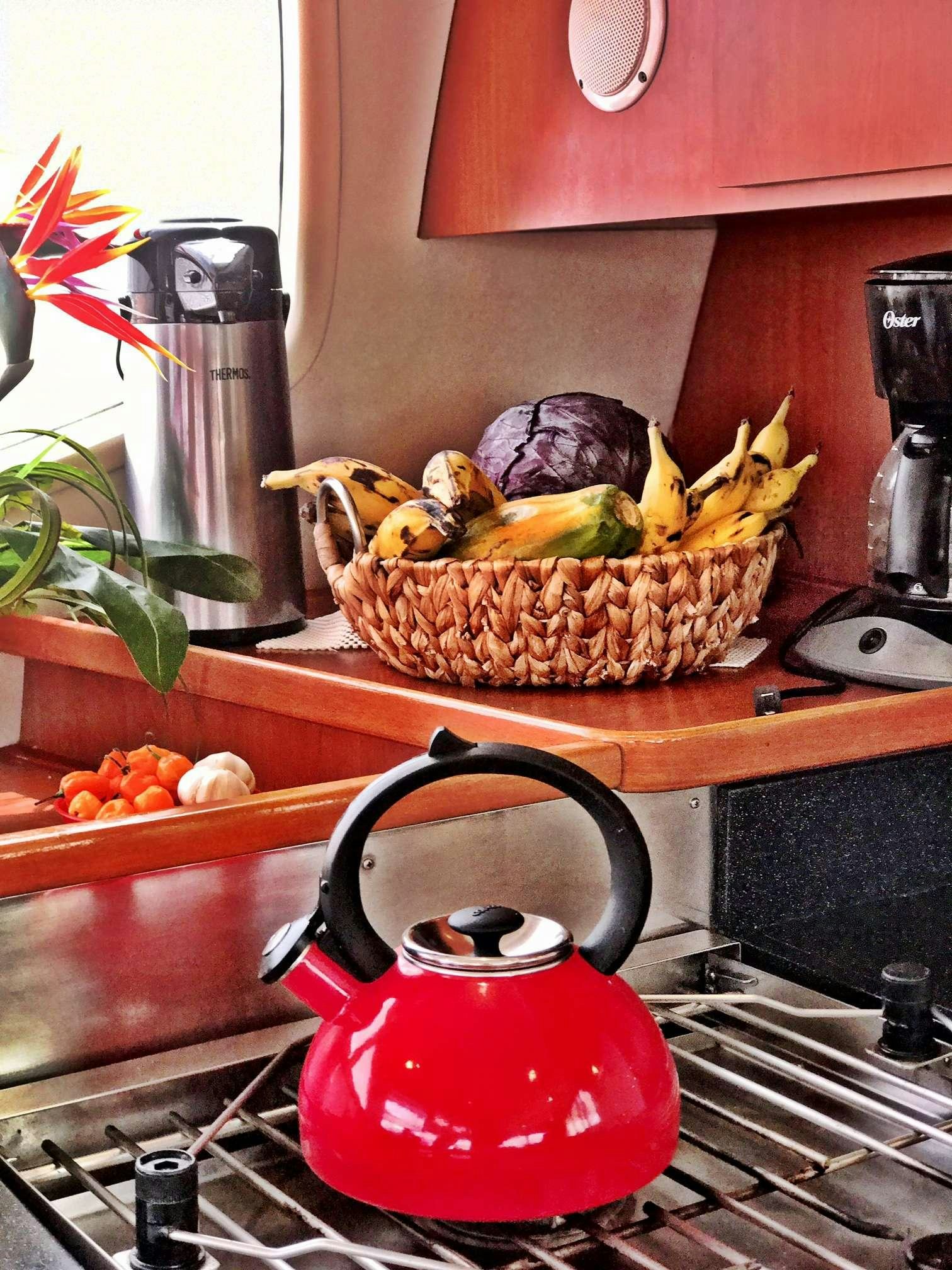 a red kettle on a counter aboard LUNA SEA Yacht for Charter