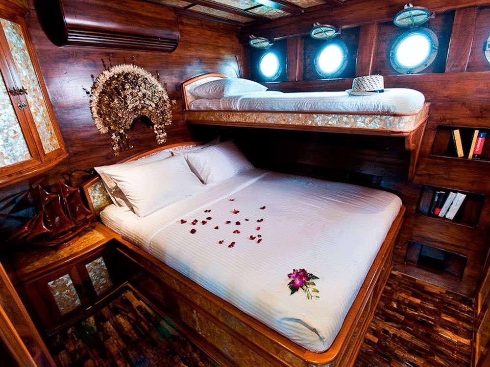 a bed in a room aboard MANTAMAE Yacht for Charter
