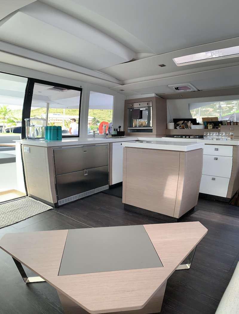 a kitchen with a large window aboard CHAMPS ELYSEES Yacht for Charter