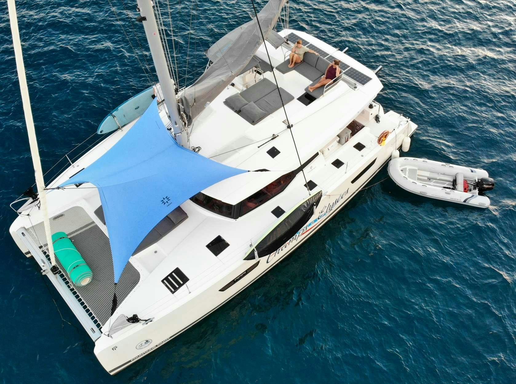 a white boat on the water aboard CHAMPS ELYSEES Yacht for Charter