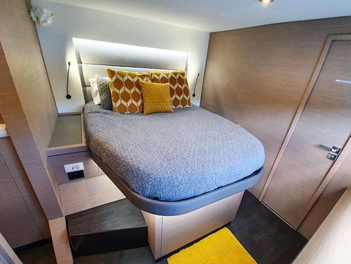 a bed in a room aboard CHAMPS ELYSEES Yacht for Charter