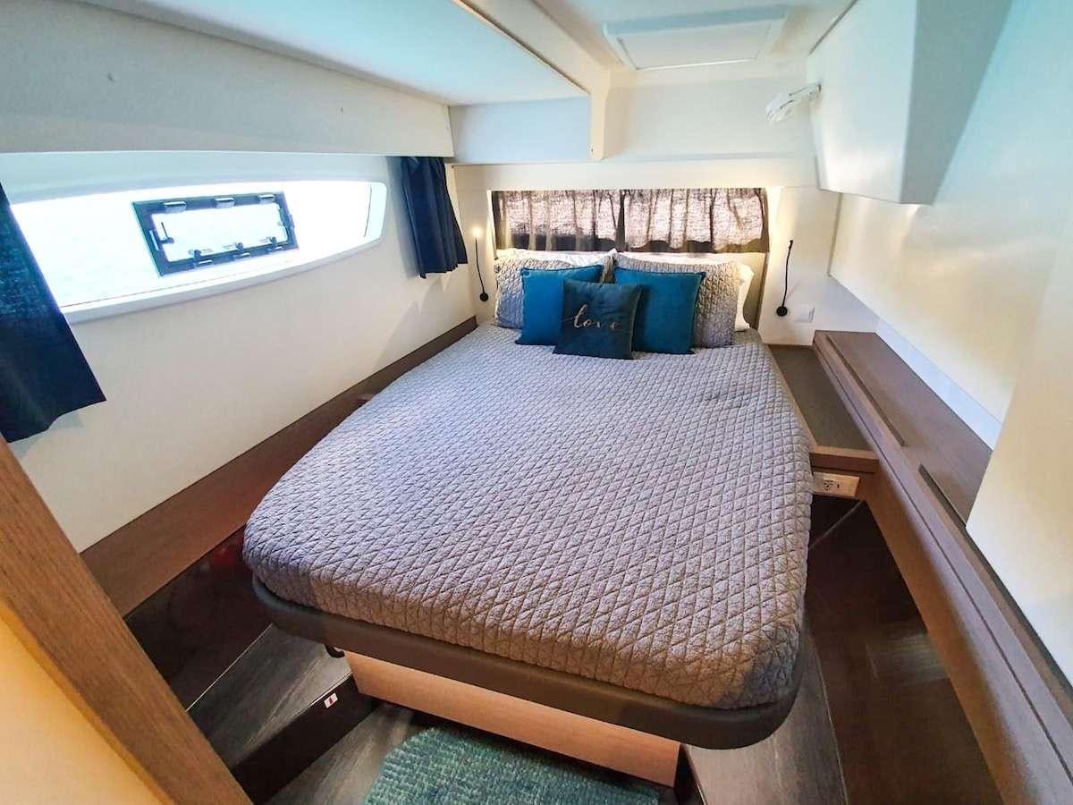 a bed in a room aboard CHAMPS ELYSEES Yacht for Charter