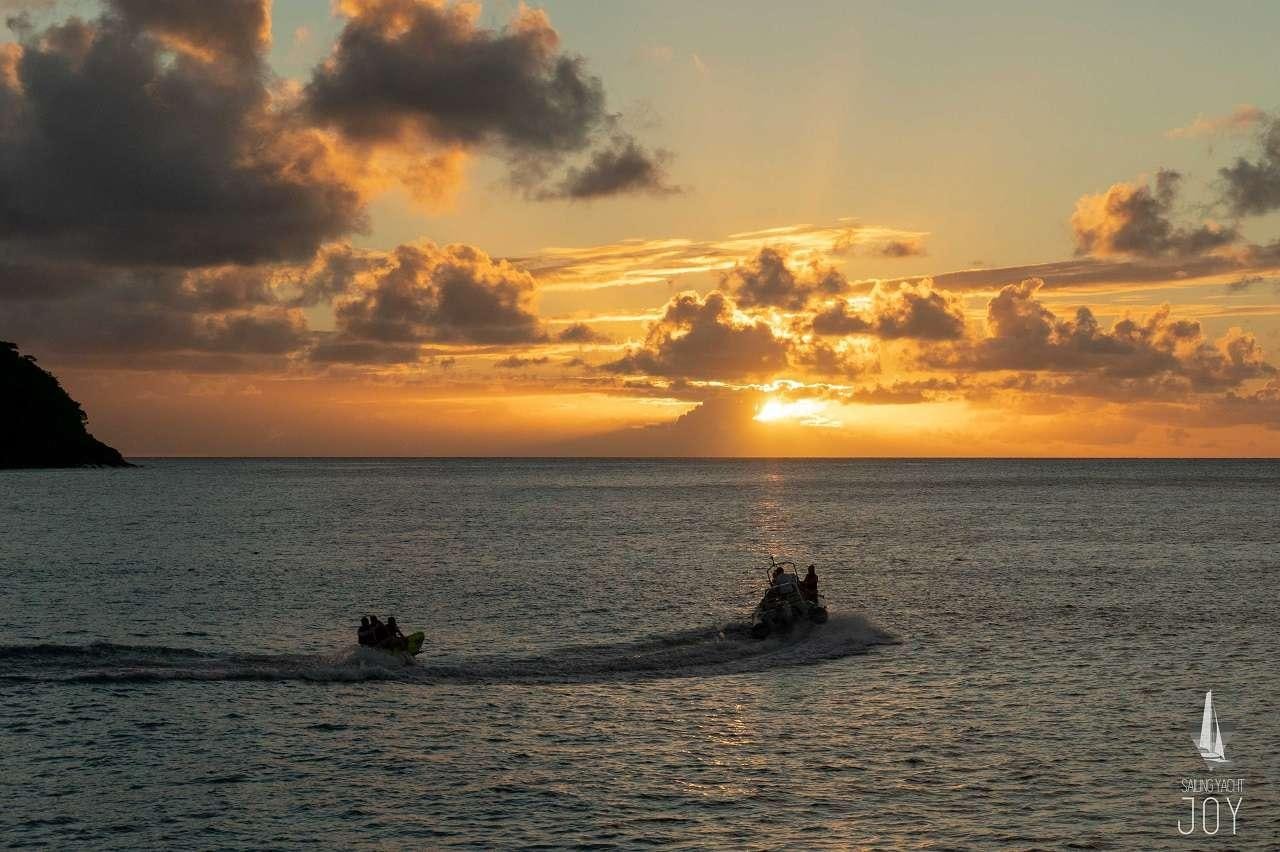 a group of people in a boat in the water aboard JOY Yacht for Charter