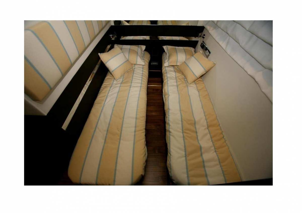 a set of stairs with striped curtains aboard DADDA Yacht for Charter