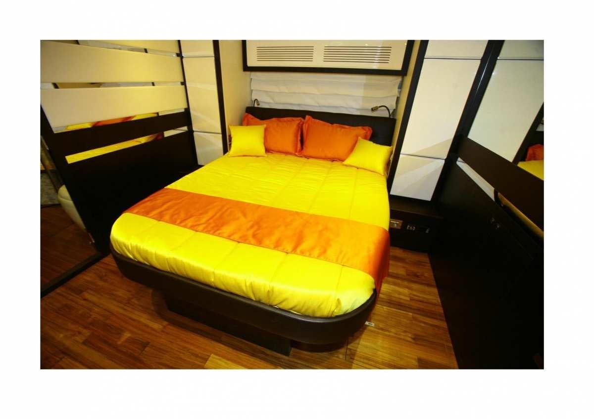 a bed in a room aboard DADDA Yacht for Charter