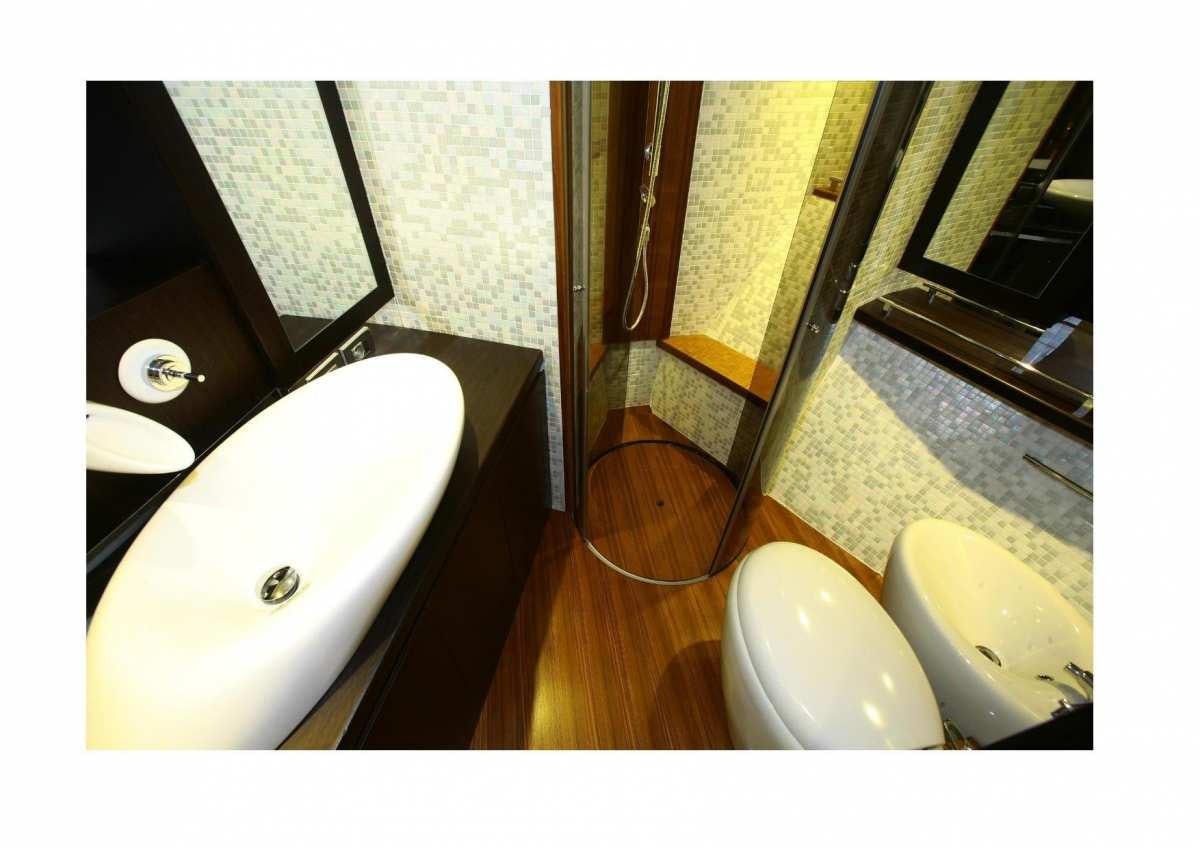 a sink and a mirror aboard DADDA Yacht for Charter