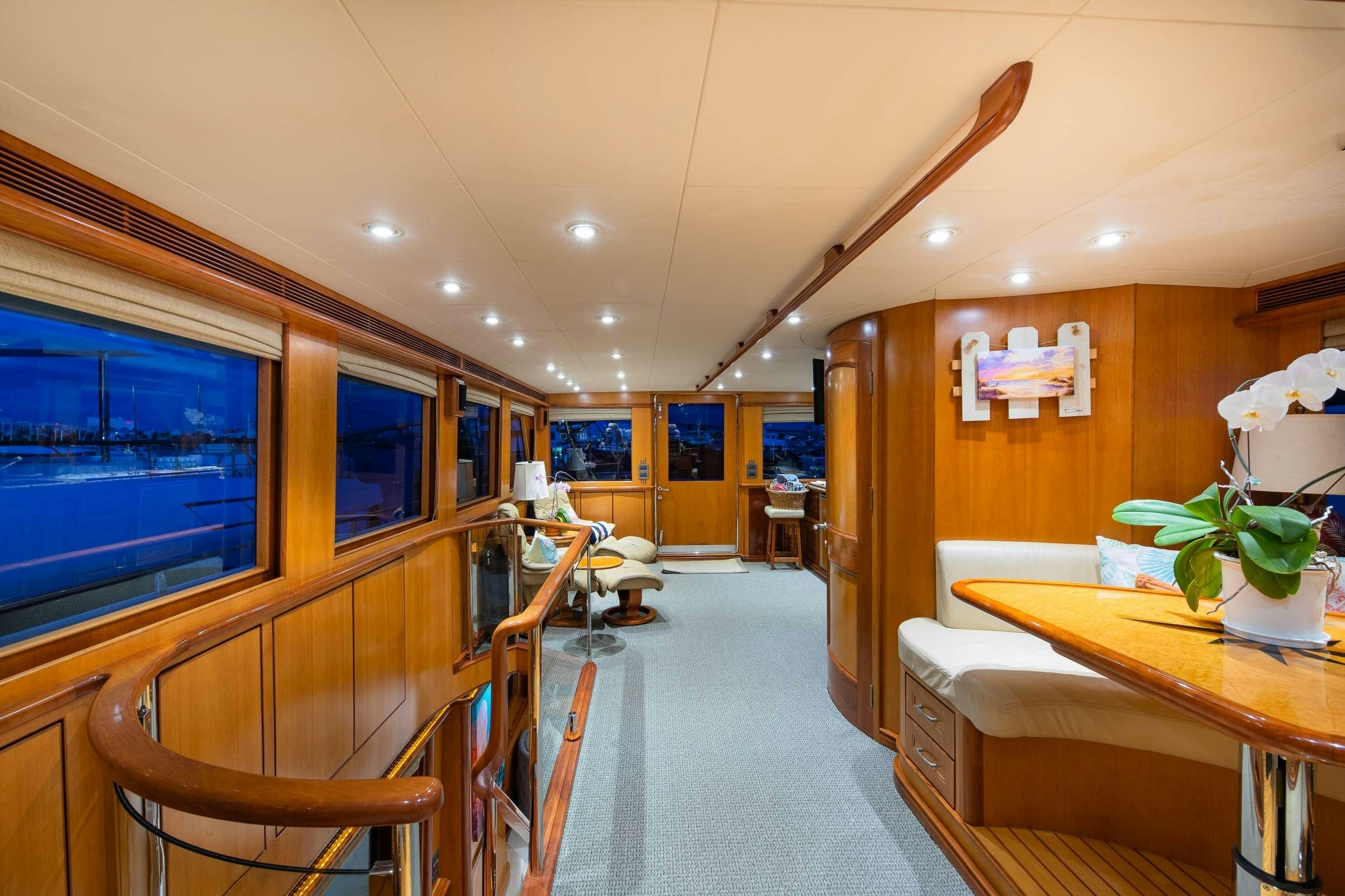 a room with a table and chairs aboard MAGICAL DAYS Yacht for Charter