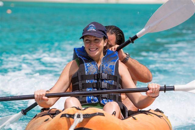a man and woman in a boat aboard MAGICAL DAYS Yacht for Charter