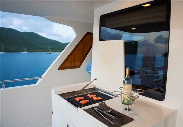a hotdog grill with hot dogs on a table aboard MAGICAL DAYS Yacht for Charter