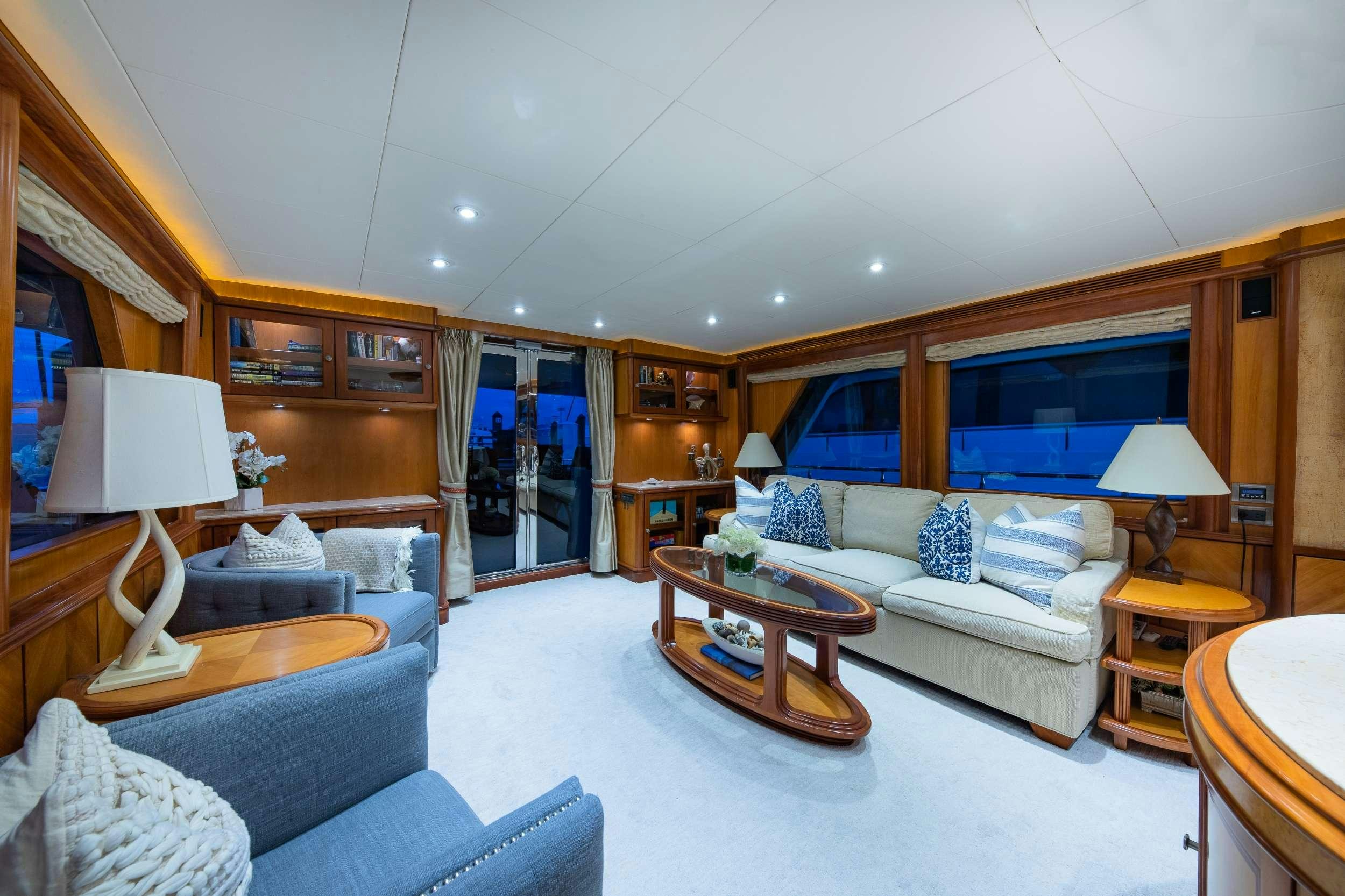 a living room with a large mirror aboard MAGICAL DAYS Yacht for Charter
