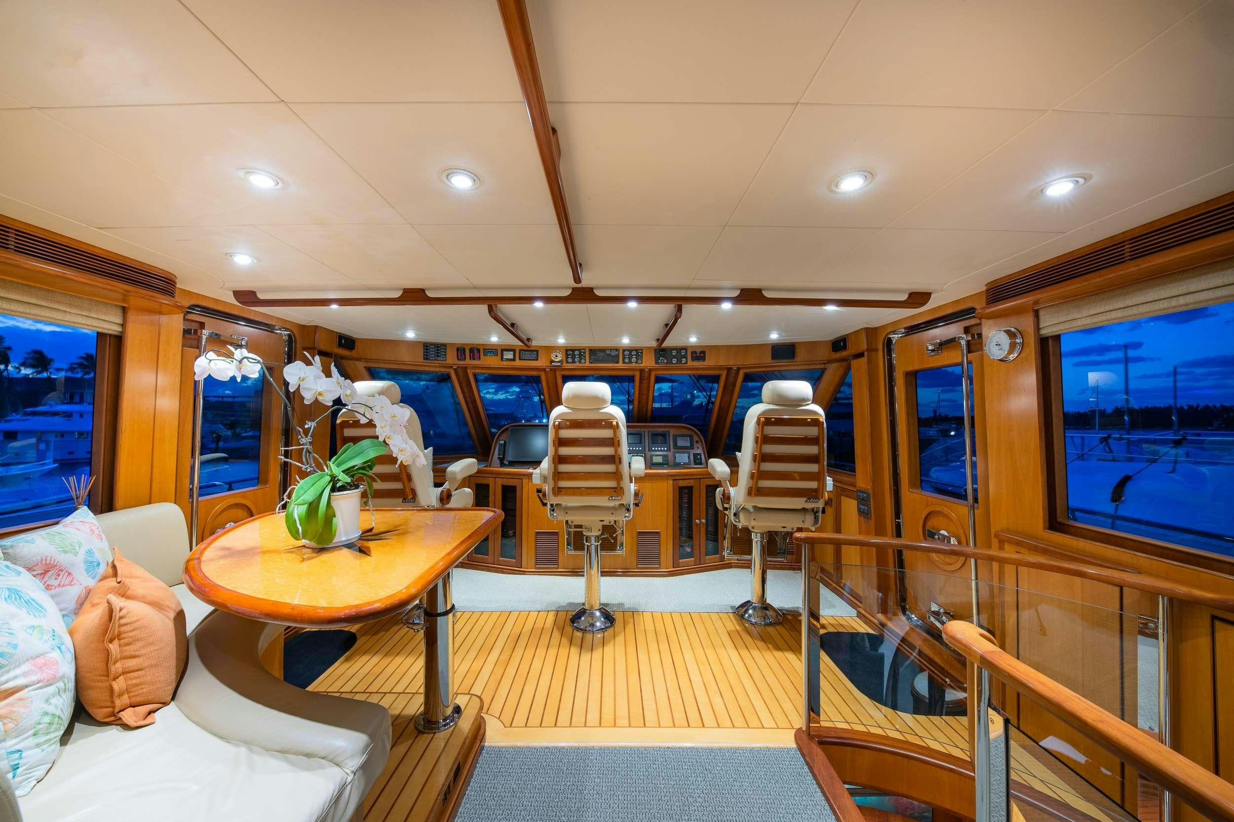 a room with a table and chairs aboard MAGICAL DAYS Yacht for Charter