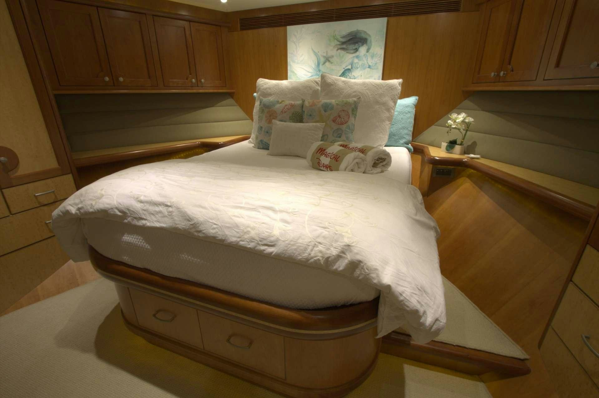 a large bed in a room aboard MAGICAL DAYS Yacht for Charter