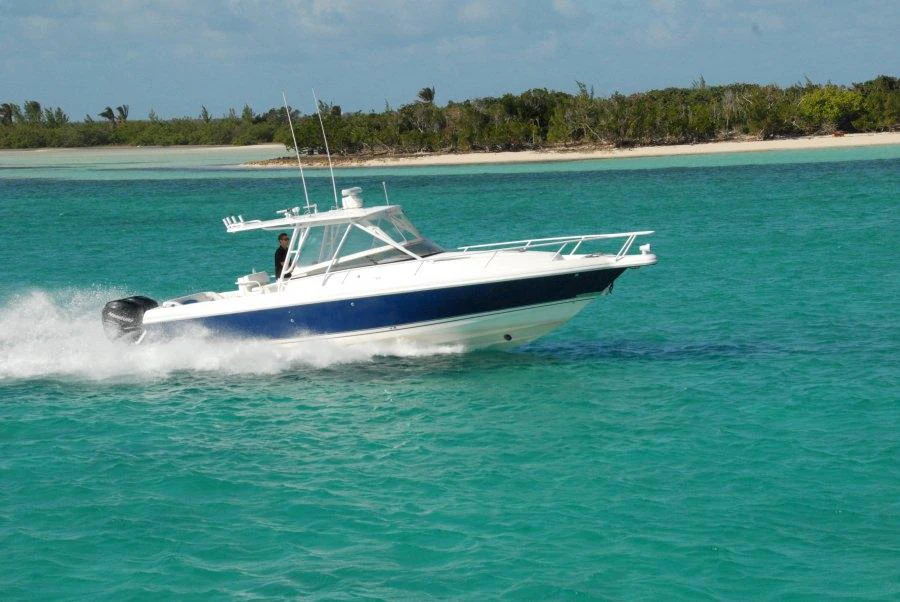 a white boat in the water aboard KALEEN Yacht for Charter