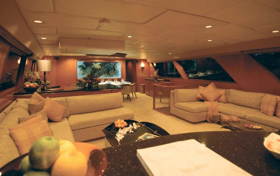 a living room with a large screen aboard KALEEN Yacht for Charter