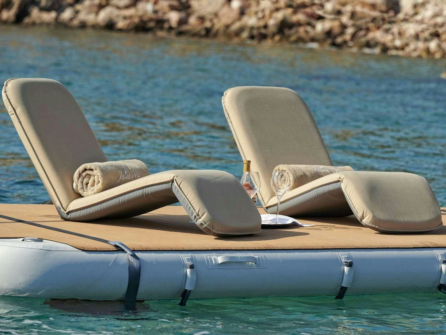 a boat on the water with Sydney Opera House in the background aboard JULIE M Yacht for Charter
