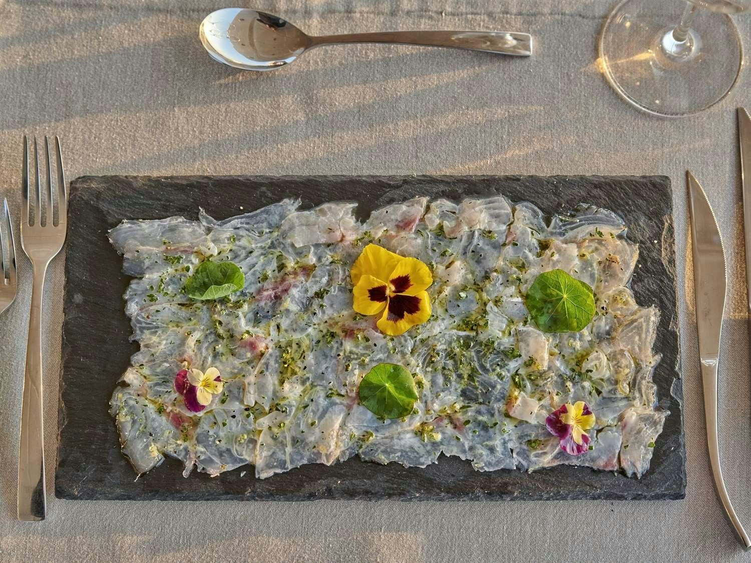 a cake with a flower design on it aboard JULIE M Yacht for Charter