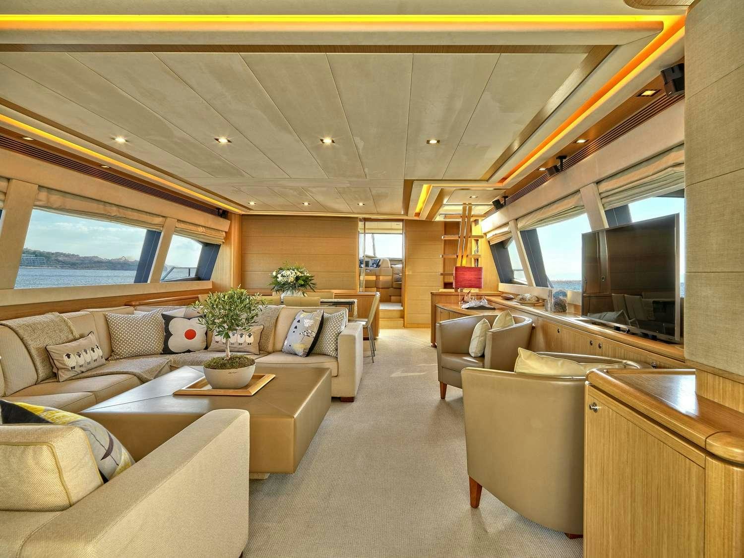 a living room with a large window aboard JULIE M Yacht for Charter