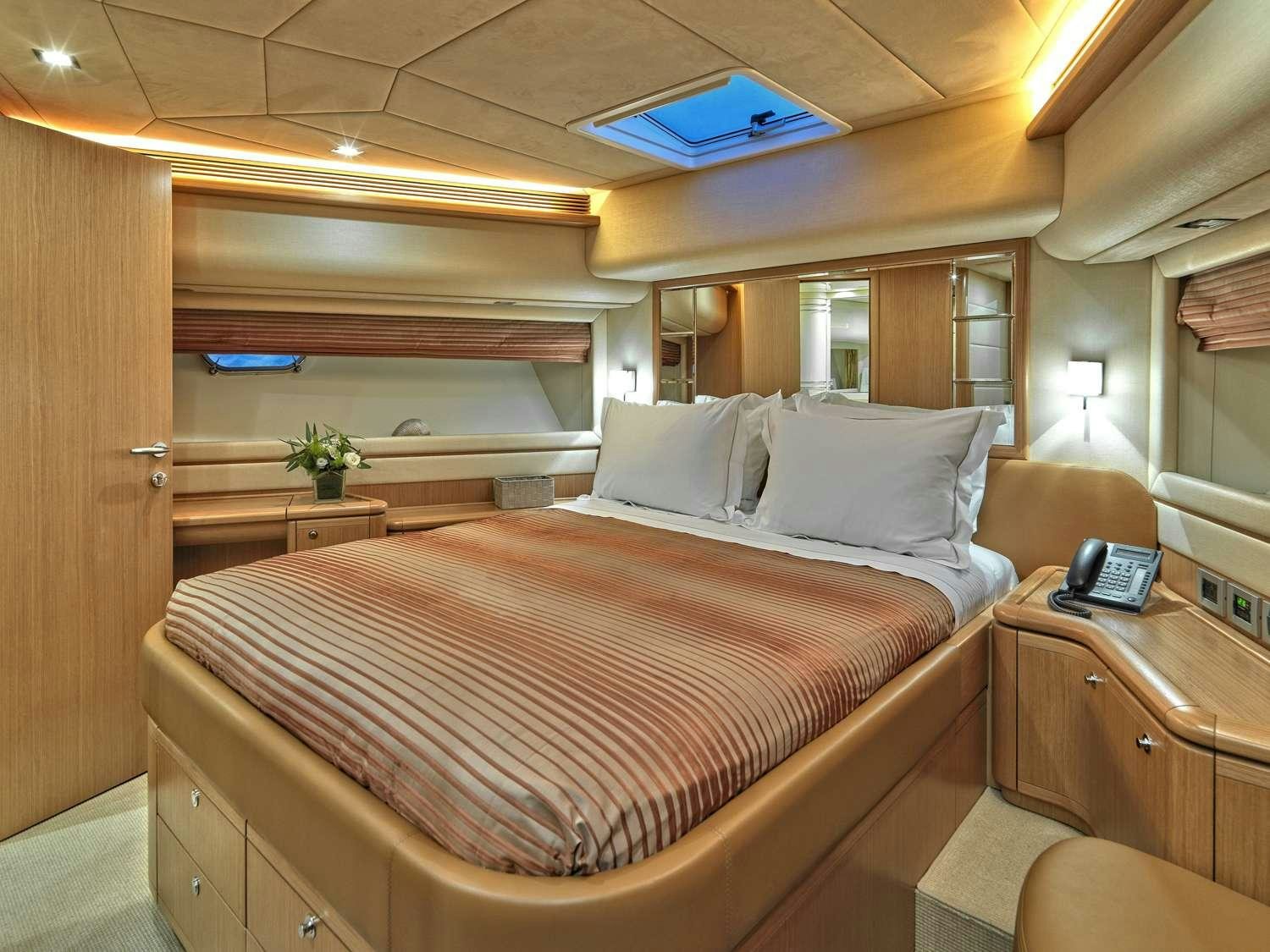 a bed with a large bed aboard JULIE M Yacht for Charter
