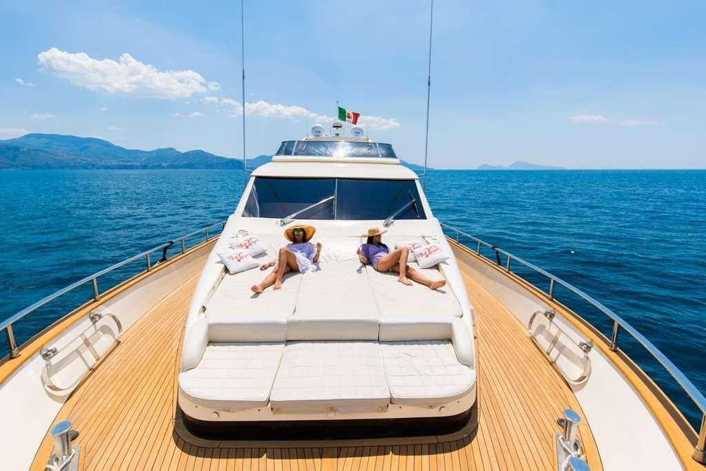 a couple of people on a boat aboard RIVIERA Yacht for Charter