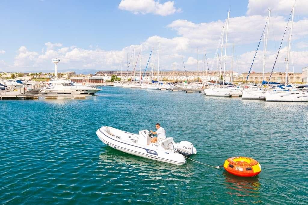 a man and a woman on a boat in the water aboard RIVIERA Yacht for Charter