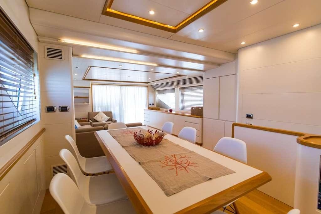 a dining table in a room aboard RIVIERA Yacht for Charter
