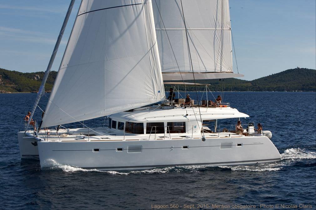 a white boat on the water aboard O CAT Yacht for Charter