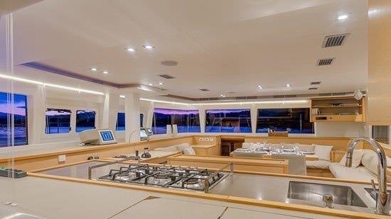 a large room with a large counter aboard O CAT Yacht for Charter