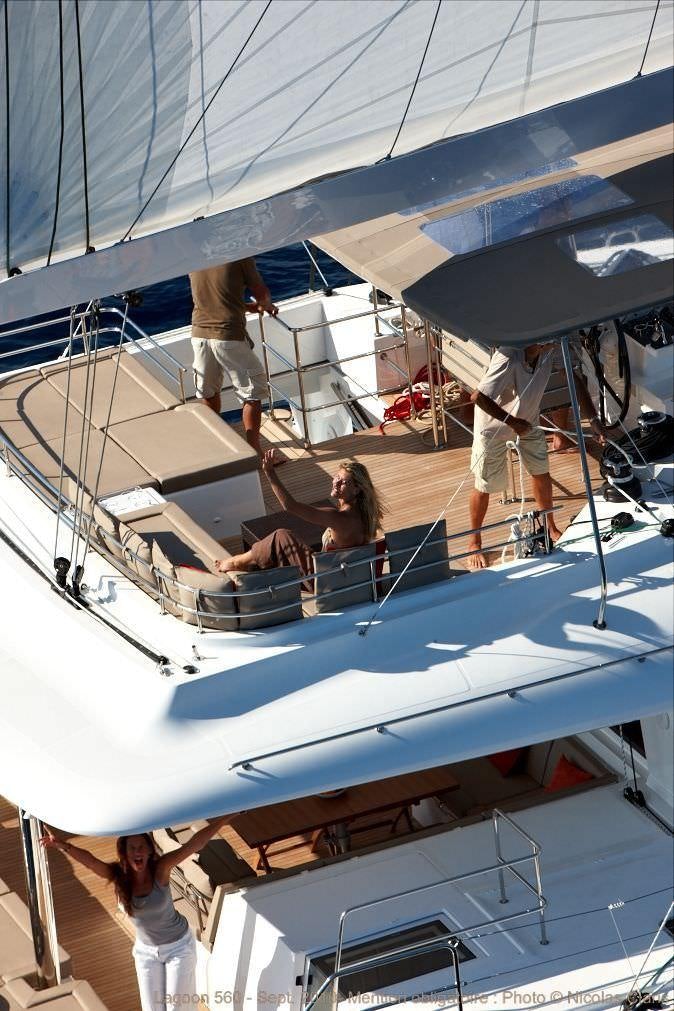 a group of people working on a boat aboard O CAT Yacht for Charter