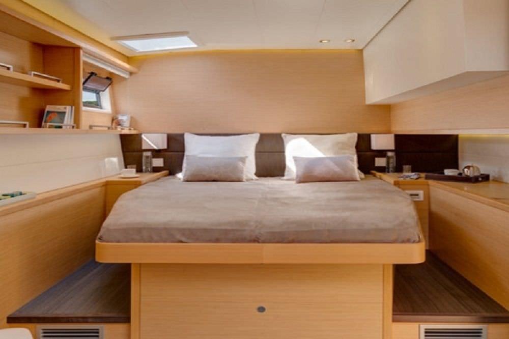 a bed in a room aboard O CAT Yacht for Charter