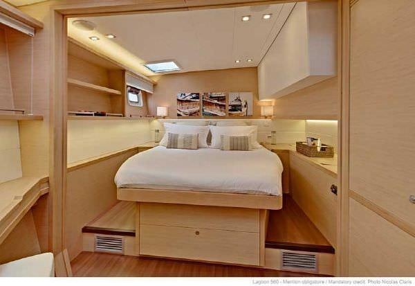 a room with a bed and a shelf aboard O CAT Yacht for Charter