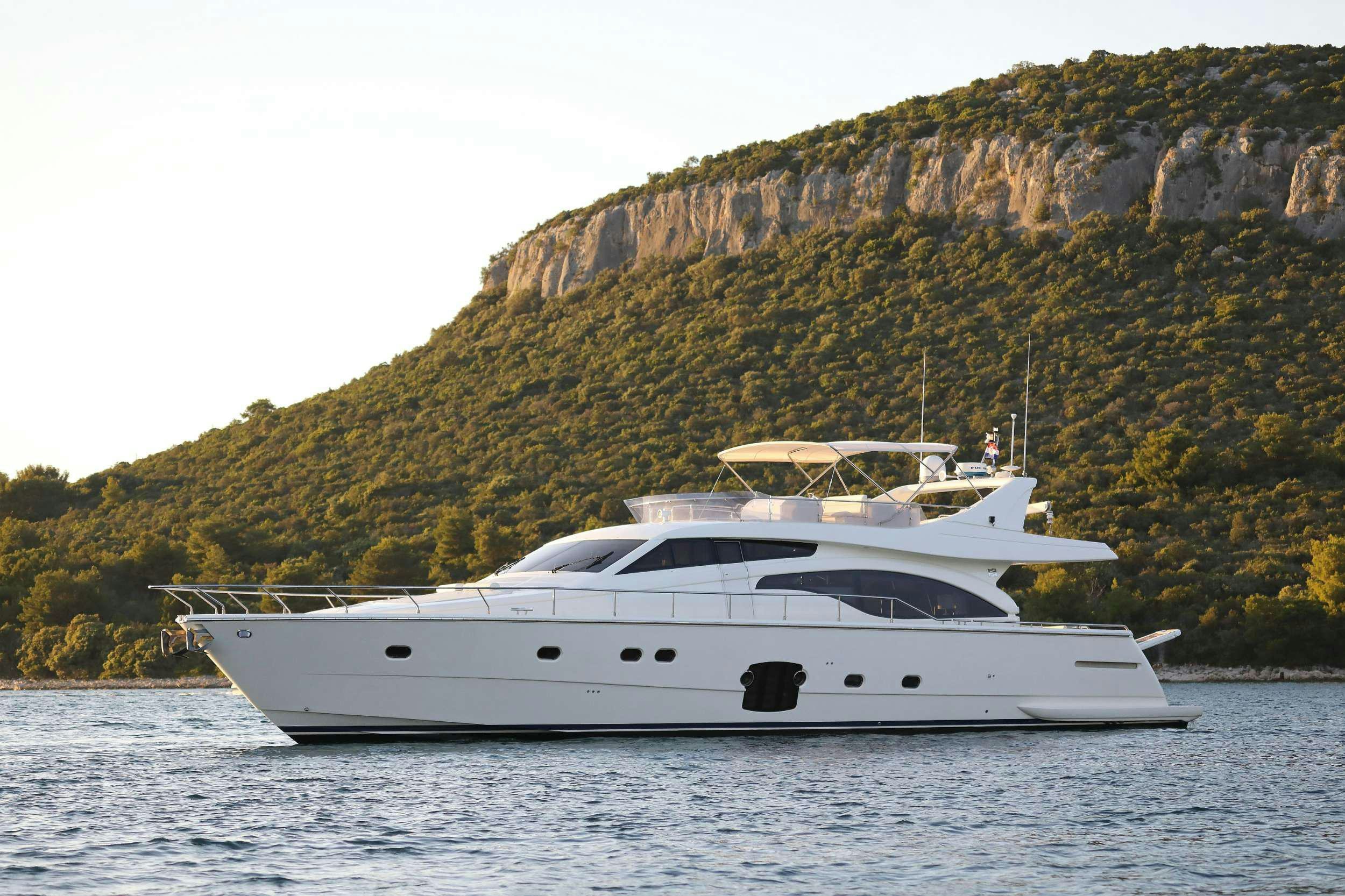 a white yacht on the water aboard dominique Yacht for Charter