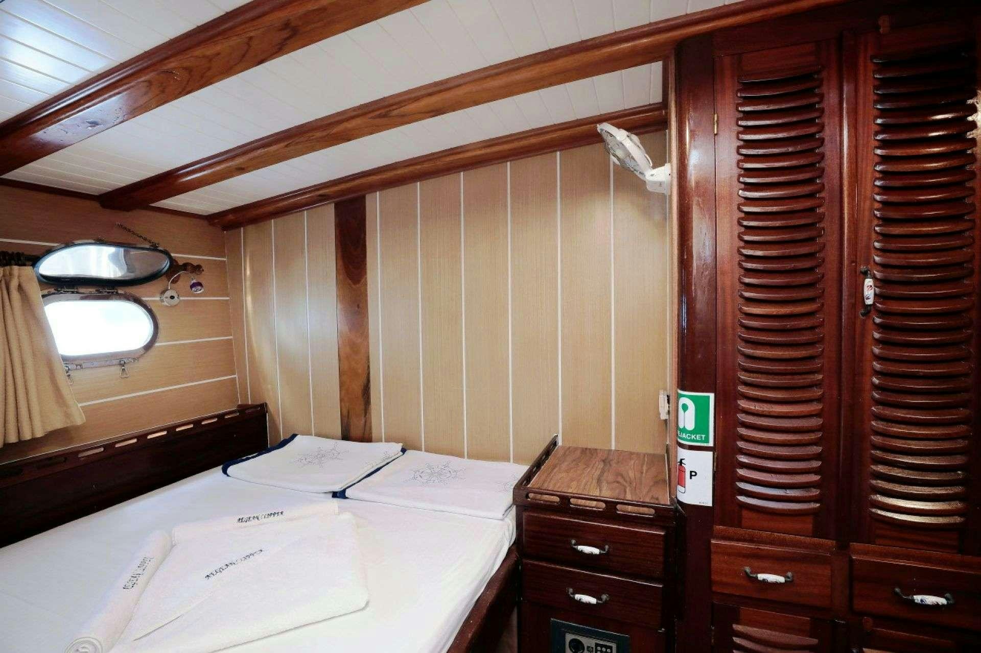 a wooden cabinet with a white counter aboard AEGEAN CLIPPER Yacht for Charter