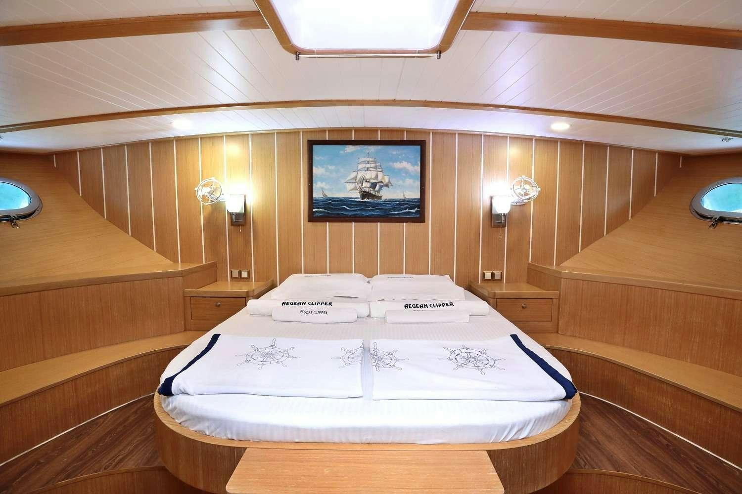 a bed in a room aboard AEGEAN CLIPPER Yacht for Charter