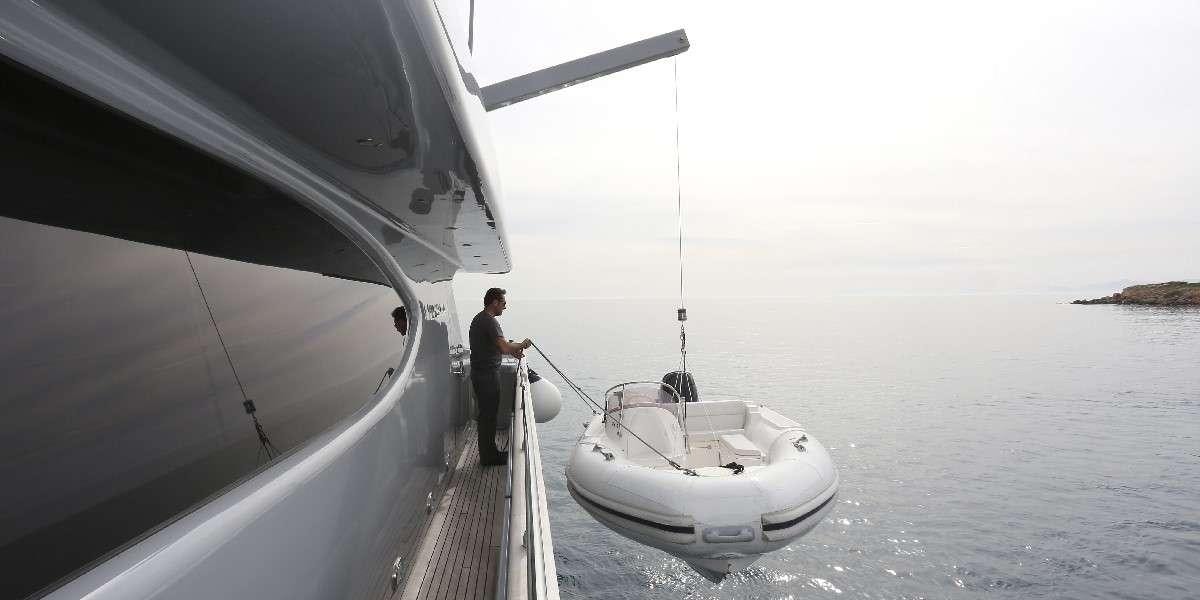 a person standing on a boat aboard IF Yacht for Charter