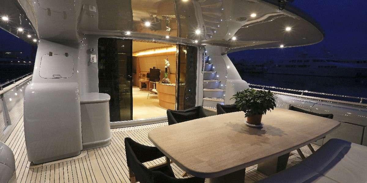 a room with a table and chairs aboard IF Yacht for Charter