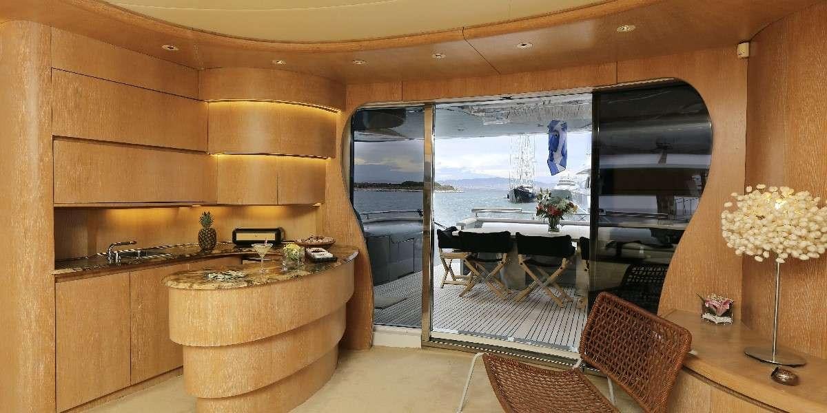 a room with a table and chairs aboard IF Yacht for Charter