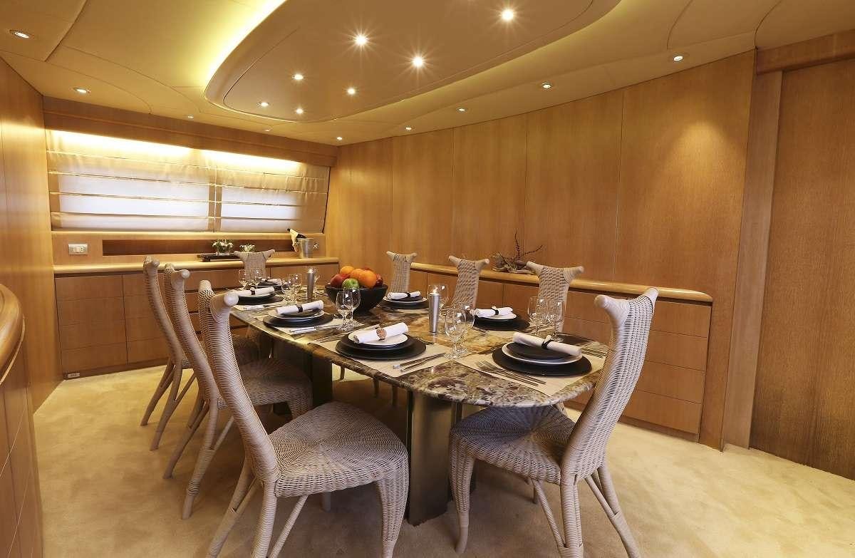 a table set for a dinner aboard IF Yacht for Charter