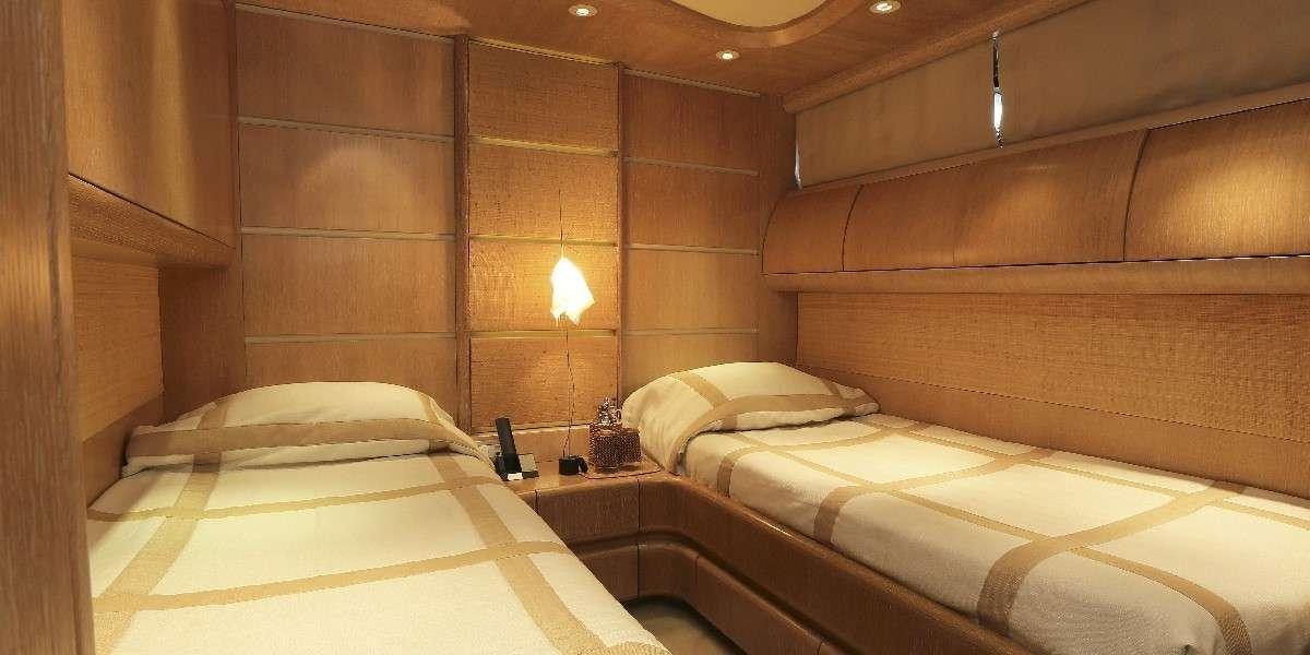 a room with two beds aboard IF Yacht for Charter