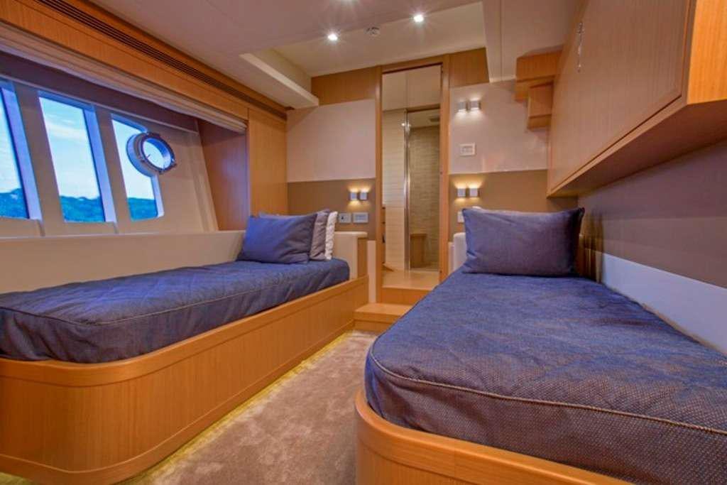 a room with two beds aboard SLAINTE III Yacht for Charter