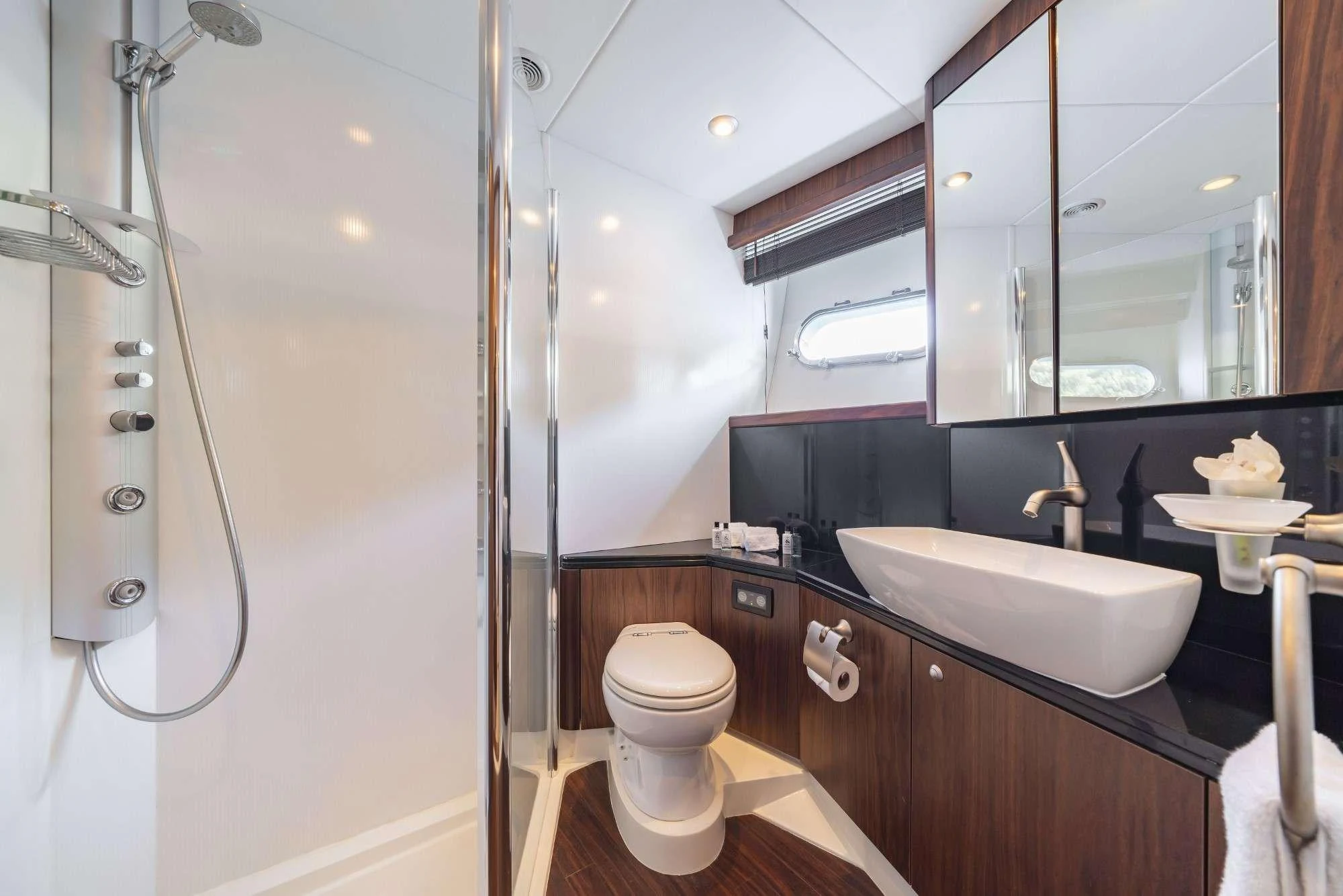a bathroom with a sink and toilet aboard LAZY P Yacht for Charter