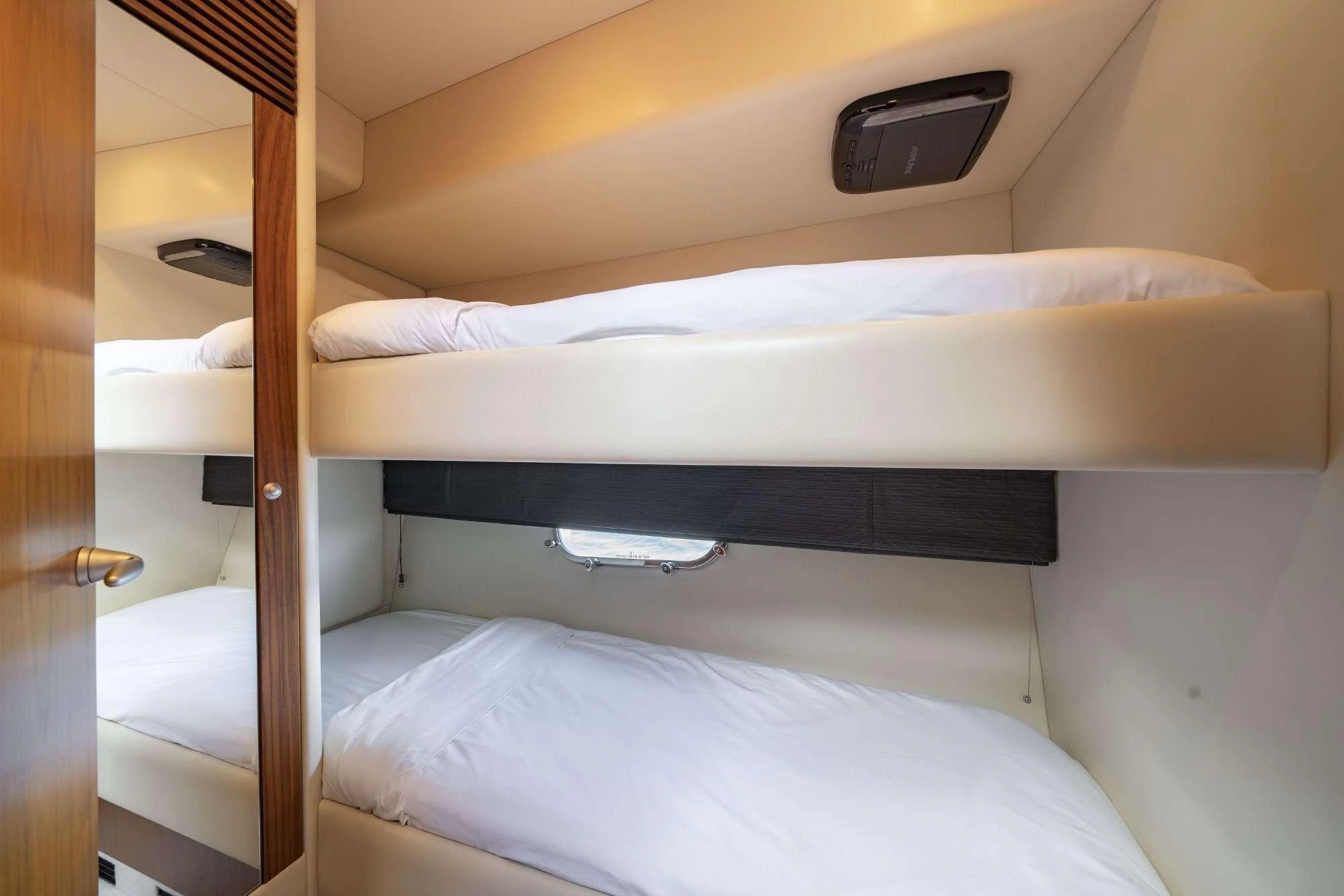 a bed with a wooden frame aboard LAZY P Yacht for Charter